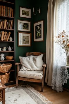 a living room with green walls and pictures on the wall, bookshelf full of books