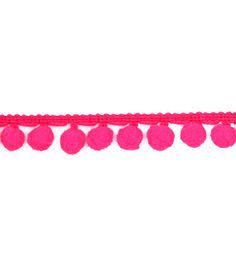 a pink tasselled ribbon with pom poms on the end and two rows of