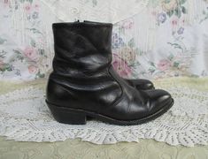 Nice black leather Chelsea style ankle boots made by HH in the USA. These have a Western style embroidery on the pointed toes, and some unique embroidery around the ankles as well. The soles look like nice quality and are stitched. There is a zipper on the inside ankle for ease in getting on. Lined in a brown material. There is some general wear, most notably some scuffing and some wear and a scratch in the toe area. But overall these are lovely and ready to wear! The soles have a squishy padding. Sizing: I can't quite make out the size written on the lining so go by the measurements below.  Measurements are in inches.  Length of inside sole: 11 6/8 Width at ball of foot: 3 3/4 Heel: 2 Rise, sole to top of boot: 8 1/2 Follow @lunarhovel on instagram for new items posted every week and sale Vintage Black Pointed Toe Boots, Vintage Black Moto Boots With Snip Toe, Vintage Fitted Boots For Festivals, Vintage Fitted Festival Boots, Vintage Black Moto Boots For Fall, Punk Bohemian, Beatle Boots, Ankle Dress, Unique Embroidery