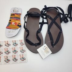 Brown Leather Sandal Base W/Black Strap Chiffon Sandal Ribbon In Color Vita Style Card Made In Uganda New With Tags . No Box As Pictured Flat W/Slight Wedge Smoke Free Home Summer Flip Flops For Everyday Use, Black Ankle Strap Barefoot Sandals For Vacation, Black Barefoot Sandals With Ankle Strap For Vacation, Adjustable Ankle Wrap Black Sandals, Brown Strappy Barefoot Sandals For Beach, Casual Adjustable Ankle Strap Barefoot Sandals, Casual Adjustable Barefoot Sandals For Summer, Adjustable Casual Barefoot Sandals For Summer, Adjustable Flip Flops For Everyday Summer Use