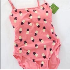 Kate Spade New York Size Xs, Nwt One Piece Swimsuit/Bathing Suit Pink (A Salmon Shade) With Pineapple Print Adjustable Spaghetti Straps Built In Cups Resort Collection Kate Spade Swimwear For Pool In Spring, Kate Spade Swimwear For Spring Pool Occasions, Kate Spade Swimwear For Spring Pool, Cute One-piece Swimwear For Pool, Cute One-piece Swimwear For Vacation, Cute Sleeveless Swimwear For Vacation, Cute Printed Summer Bodysuit, Cute Printed Bodysuit For Summer, Cute Summer Swimwear For Sunbathing