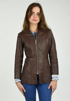 DESCRIPTION The 'Cherry' Classic Vintage 1970's Brown Leather Fitted Jacket Coat  Constructed from a Mid Weight Leather in a Chocolate Brown. Slip on Construction with Wide Fold Back Collar and Zip Front Closure. Fitted Shape with Vertical, Horizontal and Western Style Curved Panel Details on Front, Waist and Back, Two Large Curved Front Hand Pockets and Long Sleeves.  Top of Thigh Length depending on Individual Height. Lined in a Black Acetate. DETAILS: Fabric : Leather Label : BUDDHA Era : 197 Vintage Leather Jacket With Long Sleeves For Fall, Vintage Long Sleeve Leather Jacket For Fall, Fitted Vintage Brown Outerwear For Fall, Retro Fitted Leather Jacket For Winter, Retro Fitted Leather Jacket For Fall, Fitted Retro Leather Jacket For Fall, Retro Outerwear For Office, Retro Long Sleeve Leather Jacket For Work, Fitted Vintage Outerwear For Fall