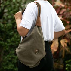 This innovative bag is designed by Peru's Karina and Maybee. Crafted from sturdy cotton canvas in clay the bag can be slung over one shoulder or converted into a backpack by unzipping the wide strap. The fully-lined bag is trimmed in supple brown leather and features zipper pockets on the interior and exterior to keep small items handy. Trim Styles, Longchamp Le Pliage Backpack, Wide Straps, Handbag Accessories, Leather Trims, Fashion Backpack, Interior And Exterior, The Go, Cotton Canvas