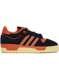 adidas Originals 
Black & Orange Rivalry 86 Low Sneakers 
Low-top brushed suede and buffed leather sneakers in black and orange. 
. Perforated detailing at toe 
. Lace-up closure 
. Logo patch at padded tongue 
. Padded collar 
. Topstitching and signature stripes at sides 
. Logo embossed at heel tab 
. Terry cloth lining 
. Logo embossed at textured rubber midsole 
. Treaded rubber sole 
Supplier color: Core black/Preloved red/Easy yellow 
Upper: leather. Sole: rubber. 
Made in Viet Nam. 
2417 High-top Adidas Suede Skate Shoes, Adidas High-top Suede Skate Shoes, Orange Skate Shoes With Contrast Sole For Streetwear, Black Suede Adidas Sneakers, Urban Orange Sneakers With Rubber Sole, Orange Low-top Skate Shoes With Contrast Sole, Orange Skate Shoes With Boost Midsole For Streetwear, Orange Leather Skate Shoes For Sports, Orange Leather Skate Shoes With Boost Midsole