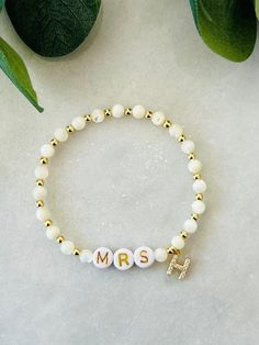 This bride bracelet with dainty initial-to-be and is a sweet and fun personalized gift for the future bride. Perfect gift for bride at bachelorette party or bridal shower. Beaded with genuine mother of pearl and 18k gold filled beads that are tarnish resistant and made to last opposed to the more commonly seen gold plated. Other coordinating pieces in shop. Beaded on high quality stretch cord and secured..     3mm 18k gold filled beads   4mm mother of pearl beads   7mm gold filled initial with c