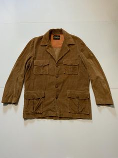 Vintage 60s 70s Calderon California Corduroy Button Western Disco Jacket Sz. M. Condition is used. Measures approximately: chest: 46 inches around (23 inches pit to pit), shoulder to hem line: 29 inches, shoulder seam to cuff: 24 inches. Spot on back bottom hem and missing belt please see pictures for details. Great buy Thanks for looking. 70s Jacket Men, Corduroy Button-up Outerwear, Vintage Corduroy Outerwear For Fall, Brown Collared Blazer With Buttons, Brown Single-breasted Corduroy Outerwear, Brown Corduroy Single-breasted Outerwear, Vintage Outerwear With Buttoned Pockets And Lapel Collar, Fall Corduroy Blazer With Button Closure, Corduroy Single Breasted Button-up Outerwear