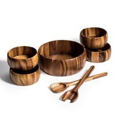 wooden bowls and spoons on a white surface