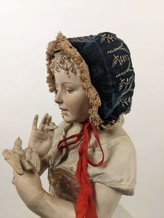 VICTORIAN CHILD’S VELVET BONNET W EMBROIDERY & LACE RUFFLE BRIM DATING TO THE VICTORIAN 19TH CENTURY FASHIONED OF A BLACK SILK VELVET THAT IS HAND EMBROIDERED ON EACH SIDE.   THE CENTER OF THE BONNET IS IN SILK WITH PIPED DETAILING WITH NET RUFFLES TRIMMING AROUND THE BRIM AND ALL AROUND THE BOTTOM.   CONDITION:  THE BOTTOM EDGE WIRE WAS ORIGINALLY COVERED IN SILK BUT MOST OF THE SILK IS ABSENT AND I PERSONALLY WOULD REMOVE.  SMALL WEAR I SEEN TO THE PIPING ON THE REAR HEAD, THE INTERIOR LINING Velvet Bonnet, Costume Room, Victorian Bonnet, Victorian Child, Medieval Hats, Edwardian Hat, Historical Hats, Lace Bonnet, Historical Dress