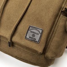 Enhance your travel experience with our exquisite Canvas Travel Backpack, now available in four captivating colors: Khaki, Army Green, Black, and Brown. Crafted for the discerning adventurer, this backpack seamlessly blends style, functionality, and durability. Timeless Design: The design of this canvas travel backpack captures the essence of adventure and the elegance of classic craftsmanship. Choose from a range of neutral color options: Khaki for a touch of sophistication, Army Green for a ru Khaki Outdoor Backpack With Zipper Closure, Multifunctional Khaki Backpack For Everyday Use, Rectangular Khaki Backpack For Travel, Khaki Backpack With Pockets For Outdoor Activities, Khaki Backpack With Pockets For Daily Use, Khaki Large Capacity Backpack For Outdoor Activities, Khaki Shoulder Bag Backpack For Outdoor, Khaki Large Capacity Travel Backpack, Practical Khaki Backpack For Travel