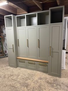 an empty room with several cabinets and drawers