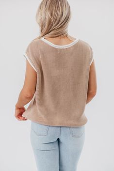 This is one of those must-have tops for dressing chic in warm weather. The Stella Sweater Vest Top features a charming, relaxed fit, paired with cap sleeves and contrast color binding; it's perfect for slipping on with linen pants, or pairing with your favorite denim. Best of all, it transitions beautifully between seasons! Available in two colorways. FIT: Runs true to size - relaxed fit. MATERIAL: 55% Acrylic, 45% Cotton. GARMENT DETAILS: Lightweight sweater knit top with a high rounded neckline, cap sleeves, and relaxed, boxy fit. Features rolled contrast binding. SIZE GUIDE: XS (0-2) / S (2-4) / M (6-8) / L (10-12) / XL (14-16) MODEL DETAILS: MISSES Mackenzie - Size S Heather - Size S Bust 34" 34" Waist 27.5" 27.5" Hips 40.5" 37.5" Height 5'7" 5'7" Spring Cotton Sweater Vest With Relaxed Fit, Casual Knit Sweater Vest For Everyday, Casual Sweater Vest For Everyday Spring Wear, Beige Soft Knit Sweater Vest For Spring, Spring Beige Soft Knit Sweater Vest, Beige Crew Neck Sweater Vest For Spring, Casual Crew Neck Sweater Vest For Spring, Casual Sweater Vest For Layering In Spring, Everyday Beige Knit Sweater Vest