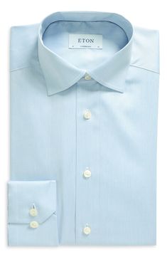 This handsome dress shirt cut from Eton's high-performance, crease-resistant fabric features a moderate spread collar and mitered, adjustable-button cuffs. Permanent collar stays French placket Back yoke Darts at the back to adjust the width Curved hem 100% cotton Dry clean or machine wash, dry flat Imported Men's Furnishings Light Blue Slim Fit Dress Shirt With Spread Collar, Light Blue Slim Fit Dress Shirt For Semi-formal Occasions, Light Blue Fitted Shirt For Office, Fitted Light Blue Office Shirt, Light Blue Fitted Office Shirt, Formal Slim Fit Light Blue Shirt, Semi-formal Light Blue Collared Dress Shirt, Light Blue Slim Fit Shirt For Business, Modern Blue Dress Shirt For Office