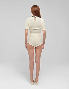 Materials: Knit cottonColors: BeigeDescription: Three-piece knitted set featuring high-waisted micro shorts and removable upper braDetailsShirt: Removable upper bra High neckline Short set-in sleeves Knitted top Cut out bra cups Shorts: High-waisted micro shorts Elastic waistband Knitted shorts Model wearing: SMADE IN ALBANIA BUST WAIST HIPS (cm)XS 84 64 94S 88 68 98M 94 72 102L 102 78 106XL 108 84 110CUSTOM SIZE: We can make any design custom based on your measurements. Customization is offered also about color and some design. Feel free to write us a message. High Stretch Beige Summer Tops, Fitted Sets With Built-in Shorts, Summer Tops With Built-in Bra, Short Length, Fitted Two-piece Summer Tops, Stretch Crop Top With Built-in Shorts, Fitted White Two-piece Top Set, White Fitted Two-piece Tops Set, Seamless Short Tops For Spring, Loungewear Tops With Built-in High-waisted Shorts