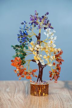 a small tree made out of glass beads