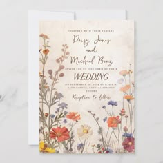 a wedding card with flowers on it