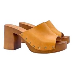 "If you prefer comfort and love casual, our clogs will adapt perfectly to your outfit. Clogs with brown \"effect\" wood base Upper in tan leather Comfortable and regular insole Wide and comfortable 8.5 cm heel and 3 cm plateau Entirely made by specialized Italian personnel Handcrafted using the best materials BEFORE COMPLETING YOUR PURCHASE DO NOT FORGET TO CHECK THE SIZE!" Casual Wooden Clogs With Wooden Heel, Casual Closed Toe Wooden Clogs, Casual Wood Closed Toe Clogs, Casual High Heel Clogs With Deep Heel Cup, Wooden Platform Clogs With Round Toe, Brown Wooden Heels For Spring, Brown Wood Heels For Spring, Wooden Clogs With Stacked Heel And Round Toe, Casual Wood Mules With Round Toe