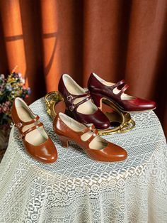 Embrace the charm of the 1930s with these timeless Double Strap Mary Jane Heels, designed for those who appreciate vintage elegance with a modern twist. Handcrafted from supple cowhide leather, these heels feature a rich brown hue that captures the essence of retro fashion. The double adjustable straps not only add to the classic Mary Jane silhouette but also provide a secure and comfortable fit, making them perfect for all-day wear. The interior is lined with soft pigskin for a luxurious feel, while the sheepskin insole offers cushioning with every step. The rubber outsole ensures durability and a confident stride, no matter where your day takes you. Standing on a graceful 2.5 inches (6.5 cm) heel, these shoes offer the perfect balance of height and comfort, allowing you to step back into Vintage Heels With Penny Strap And Almond Toe, Vintage Almond Toe Heels With Penny Strap, Vintage Brown Low Heel Heels, Vintage Closed Toe Heels With Penny Strap, Vintage High Heel With Penny Strap, Brown Vintage Ankle Strap Heels, Vintage Brown Ankle Strap Heels, Vintage Brown Heels For Formal Occasions, Vintage Brown Almond Toe Heels