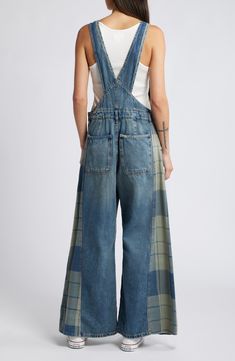 Retro charm meets workwear-inspired ruggedness in these ultrabaggy denim overalls faded to old-favorite perfection and boasting panels of patchwork-style plaid. Adjustable buckle straps; side button closures Square neck Chest patch pocket; front slant pockets; back patch pockets 100% cotton Machine wash, tumble dry Imported Free People Overalls, Patchwork Denim, Fringe Skirt, Floral Shoes, Poncho Cape, Denim Patchwork, Mens Scarves, Plaid Fashion, Scarf Men