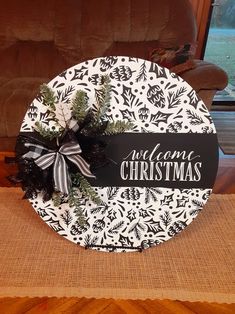 a black and white plate with a christmas sign on it