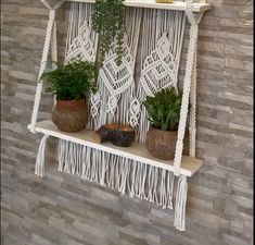 macrame wall hangings with plants on them