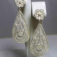 High Detail & Quality Fascinating "Frosted" .925 Sterling Silver Diamond Cut Filigree 2 Piece Drop / Dangle Earrings Stud & Butterfly Fasteners Size = 2 1/2" Drop Width = 1" Weighs = 6.1 Grams Each White Intricate Design Drop Earrings, White Intricate Design Dangle Earrings, Sterling Silver Filigree Jewelry For Party, Filigree Drop Jewelry For Anniversary, Ornate White Dangle Earrings, White Filigree Jewelry For Formal Occasions, White Dangle Bridal Earrings With Intricate Design, White Bridal Earrings With Intricate Dangle Design, Ornate White Filigree Earrings