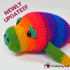 a crocheted rainbow colored stuffed animal with the words newly updated written on it