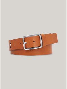 Tommy Hilfiger men's belt. Add a dash of branded finesse to your outfit with this smooth leather, belt featuring a sleek, square metal buckle embossed with our Tommy logo.  Material: 100% Leather (fwa). Brown Leather Belt Buckles With Logo Plaque, Brown Leather Belt Buckle With Logo Plaque, Brown Leather Belt With Logo Plaque, Modern Leather Belt With Engraved Logo, Formal Leather Belt With Engraved Logo, Classic Brown Belt With Logo Plaque, Modern Brown Belt With Logo Plaque, Leather Belt Buckles With Logo Plaque, Classic Formal Belt With Engraved Logo