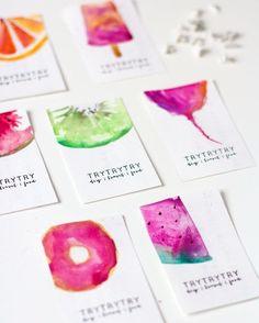 six watercolor cards with different designs on them, each one has a bite taken out of it