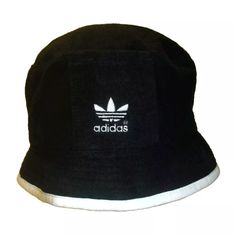 Brand New Mens Adult Vintage 90s Adidas Bucket Hat. This Bucket Hat Is Mens Sz. Small/Medium. The Front Has The Embroidered Adidas Logo On It In White. The Colors Of It Are Black And White Made By Adidas. Made Of 100% Cotton Material. Adidas Adjustable Casual Bucket Hat, Adidas Casual Adjustable Bucket Hat, Vintage Brimmed Hats For Streetwear, Vintage Brimmed Streetwear Hats, Adidas Cotton Hats For Summer, Adidas Cotton Summer Hats, Sporty Short Brim Hat For Streetwear, Casual Visor Bucket Hat For Streetwear, Retro Black Hat For Spring