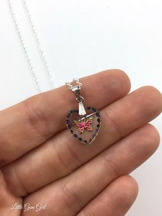 This gorgeous Butterfly pendant is a miniature work of art! 15x14mm glass heart contains the carving of a rainbow butterfly and is surrounded by rainbow etchings along the edge. It's reversible - one side is flat with richer rainbow colors and the other side is carved with softer rainbow colors. Comes with a 20 inch sterling silver link chain or a silver plated link chain in the length of your choosing. Please make your selection from the drop down menu. Other styles available - see photos for s Butterfly Heart, Silver Link Chain, Rainbow Butterfly, Butterfly Pendant Necklace, Etched Glass, Glass Heart, Butterfly Pendant, Sterling Silver Chain, Link Chain