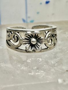 Toe ring flower floral scrollwork band size 3.50 sterling silver women  Size 3.50 adjustable Weight.   1.9g Width        1/4" Thinnest part  of band in back   3/16" Free Shipping & Free Postal Insurance  Delivered in a Gift Box  Let me know if you prefer the ring polished ... otherwise I wont as some people prefer patina .Will include a mini polishing cloth  Free First Class shipping and postal insurance is included. If you want to upgrade to priority kindly pay an additional fee to do so.  This Adjustable Flower Ring For Spring Wedding, Adjustable Flower Promise Ring For Spring, Adjustable Flower Ring For Spring Anniversary, Adjustable Sterling Silver Ring For Spring, Adjustable Rings For Spring Promise Ring, Spring Anniversary Adjustable Flower Ring, Vintage Silver Toe Ring With Flower Design, Silver Flower Rings With Adjustable Fit, Silver Bohemian Rings For Spring