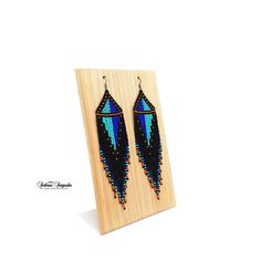 Turquoise black Geometric earrings Abstract earrings Unusual earrings Minimalist earrings Statement earrings Hippie earrings Long dangle earrings Fringe earrings Turquoise blue Seed bead earrings Czech bead earrings Beaded earrings These earrings in a fantastic, cosmic style, made of high-quality Czech beads. They have a durable titanium-colored metal hook. Colors: Black + Turquoise + Blue + Gold Length of the Earrings - 5.5 inches (14 cm) 100% handmade Czech seed beads. Shipping worldwide Gift Minimalist Earrings With Dangling Beads As Gift, Handmade Minimalist Beaded Dangle Earrings, Minimalist Handmade Beaded Dangle Earrings, Minimalist Drop Earrings With Dangling Beads, Blue Minimalist Dangle Jewelry, Black Long Drop Beaded Earrings For Gift, Black To Red Ombre, Cactus Earrings, Abstract Earrings