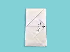 an origami piece with the word prut written on it in cursive writing