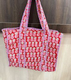 Women Tote Bag Handmade Block Printed Quilted Shoulder Bag's Indian Shopping Handbag Throw Cotton Quilted block print weekend bags 100% cotton fabric SIZE:- 14 inch X 17 Inch X 6 Inch Usage : Cosmetic, Make-up, Travel, Toiletries, Tote Bag, Medicine, Accessories, Shoulder Bags, Handle Bag, Women Bags, Cosmetic Bag, Gift For Her, Bridesmaid Bag, Storage Bag, Grocery Bag, Shopping Bag, Carry Bags, Jhola Bag, Market Bag, Vintage Bags, Picnic Bags, Etc Shopping and much more. Perfect for Beach Visits/ Quick Grocery runs/ Carrying Kids items/ Artist Paint book and Paints /Extra Bag Washable on Cold / Delicate wash Gorgeous Prints of Hand printed cotton are brought together to give an alternate to plastic bags usage . Posted in a flat pack folded. NOTE: ✔ Disclaimer: Natural-dyed colors might bl Reversible Square Bags, Red Cotton Beach Bag, Reversible Square Shopping Bag, Reversible Square Shoulder Bag For Shopping, Reversible Square Shoulder Bag, Red Cotton Double Handle Shoulder Bag, Red Double Handle Cotton Shoulder Bag, Rectangular Cotton Bag For Vacation, Square Cotton Beach Bag For Travel