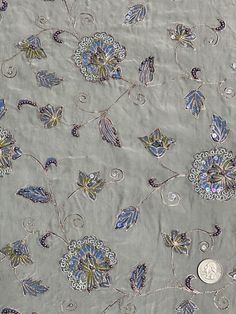 Distinguished by its luxurious design, this high-quality Grey Sequin & Beads On Silk Chiffon JEC-147/2 Fabric is perfect for women's high-end evening dresses, costumes, jackets, and skirts. Our unique and distinctive fabric is available in a wide selection of colors. The fabric is sold by the Yard, and measures 44 inches in width. Elegant Embellished Embroidered Fabric, Elegant Embellished Embroidered Fabric For Festive Season, Elegant Embellished Embroidered Fabric For Celebration, Embellished Silk Embroidered Fabric For Reception, Festive Formal Embroidered Fabric With Sequins, Festive Formal Embroidered Sequin Fabric, Elegant Embroidered Fabric With Sequins For Formal Use, Elegant Embroidered Fabric With Sequins For Formal Occasions, Elegant Embroidered Fabric With Mirror Work For Reception