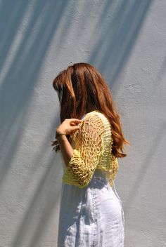 Sweet and simple little yellow shrug for summer days when all you need is a light weight cover-up to cover shoulders and upper arms. I hand knit this item with a cotton viscose ethically sourced yarn. It is very soft and comfortable. The open-net/loose-knit style will keep you cool but still giving you the coverage you need. Hand knitted shrug Sleeve length: Half sleeve, reaches half way between elbows and wrist. Color: Soft Yellow Ecru/Ivory Taupe/beige with specks of yellow Size: Small, Medium Beach Open Knit Shrug, Open Knit Summer Shrug For Beach, Open Knit Shrug For Summer Beach, Summer Beach Open Knit Shrug, Summer Long Sleeve Open Knit Shrug, Yellow Bohemian Cardigan For Summer, Stretch Open Knit Cover-up For Spring, Summer Long Sleeve One-size Shrug, Summer Bohemian Yellow Cardigan