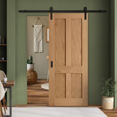 an open wooden door in a green room next to a white rug and potted plant