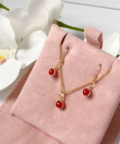 This beautifully simple necklace and earring set is lovingly handmade with tiny Carnelian gemstones and a choice of 14k Gold Filled, 14k Rose Gold Filled or Sterling Silver Chain. M A T E R I A L S: * Carnelian * 14k Gold Filled, 14k Rose Gold Filled or Sterling Silver Chain S I Z E: *  Gemstones - Approximately 4mm *  Chain Thickness - Approximately 1.1mm  All of our jewellery is carefully handmade using good quality materials and handpicked gemstones, with the aim to produce quality pieces that you can love & wear for years to come.  C A R N E L I A N: * July Birthstone * Talisman for Taurus, Cancer, Leo, Virgo * Sacral Chakra, Base Chakra A stabilising stone, Carnelian restores vitality and motivation, and stimulates creativity.  It gives courage, promotes positive life choices, dispels Carnelian Drop Earrings Jewelry Gift, Gold Carnelian Jewelry With Matching Earrings, Dainty Necklaces With Matching Dangle Earrings, Dainty Jewelry Sets With Matching Earrings As Gift, Dainty Necklaces With Matching Earrings For Gifts, Dainty Necklace With Matching Earrings For Gift, Dainty Jewelry Sets As A Gift, Jewelry Sets With Dangle Earrings As A Gift, Delicate Jewelry Sets With Matching Earrings As Gift