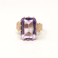 Gorgeous antique circa 1890s Victorian era 10k rosy yellow gold genuine amethyst ring! This stunning ring features a rectangular faceted 7 carat genuine amethyst gemstone, that is securely prong set. There are intricate designs down the tapered shoulders. An exquisite piece of fine Victorian era jewelry, featuring February's birthstone! *Sale - price reduced from $750 USD to $740 USD.  ERA - Circa 1890s - Victorian METAL / MATERIAL - 10k rosy yellow gold, genuine amethyst (approx. 7 carats) MARK Antique 14k Gold Amethyst Ring, Victorian Style Purple Rings In 14k Gold, Victorian Amethyst Ring In Yellow Gold, Victorian Yellow Gold Amethyst Gemstone Ring, Victorian Style Purple Ring In 14k Gold, Victorian 14k Gold Ring In Purple, Victorian 14k Gold Purple Rings, Victorian Yellow Gold Amethyst Ring, Victorian Style 14k Gold Rings In Purple