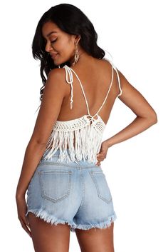 Keep it festive in this adorable fringe halter top! It features a sleeveless bodice. halter straps that lead to a back tie closure. a deep V neckline. a sheer inset underneath the bust. and fringe detailing that flows down. The top is composed of a crochet fabric with moderate stretch.Model is 5'8" with a 32" bust. 23" waist and 36" hips. She is wearing a size small. Fringe Halter Top, Crochet Fabric, Children Shoes, Sweater Shop, Halter Top, Deep V, Bodice, Camisole Top, White And Black