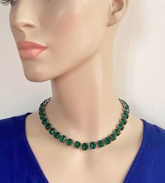 Choker length emerald paste riviere necklace.  Large rectangular faceted stones with closed back settings.  Vibrant deep green crystals. Bright silver tone metal. Hinged clip.  Circa 1970s.  Condition: Excellent for vintage.  Clasp works well.  Minor signs of age and use can be expected. Ready to wear or gift.  Weight: 47.1g Presentation:  Smart gift pouch, suitable for any occasion.  Please note that any boxes you see in photos are usually just for display purposes.  To ensure there's no confus Green Rhinestone Necklaces For Formal Occasions, Formal Green Rhinestone Necklaces, Formal Green Rhinestone Jewelry, Green Crystal Rhinestone Necklace For Formal Occasions, Green Rhinestone Necklace For Formal Occasions, Formal Green Rhinestone Necklace, Riviere Necklace, Smart Gift, Gift Pouch