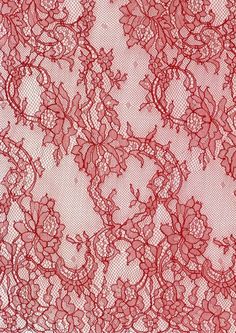 a red lace fabric with flowers on it