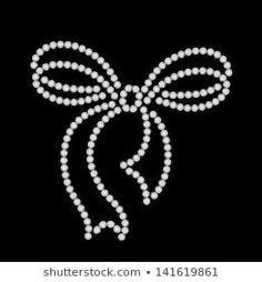 a bow made out of pearls on a black background with the word love written in it