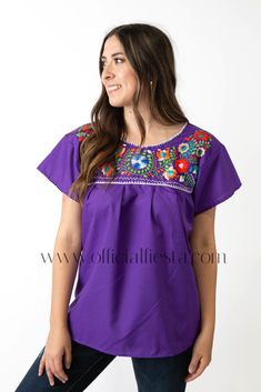 Mexican Embroidered Pueblo Blouse - Purple  These fabulous blouses feature a unique colorful embroidered pattern. These embroidered blouses are also commonly known as Mexican Peasant Blouse Tops.  Please note that each blouse is individually hand embroidered so the embroidery design will vary from the one pictured. You will receive the blouse color selected. Purple Embroidered Short Sleeve Blouse, Folk Style Blouse For Fiesta, Embroidered Fiesta Blouse, Folk Style Short Sleeve Blouse For Fiesta, Bohemian Purple Blouse With Floral Embroidery, Embroidered Bohemian Purple Blouse, Bohemian Embroidered Purple Blouse, Purple Embroidered Bohemian Blouse, Bohemian Purple Embroidered Blouse