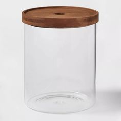 a glass jar with a wooden lid