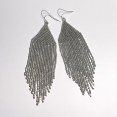 These amazing alabaster earrings have a hint of gold shine and are hand crafted by women in the Philippines being economically empowered so they can get out of poverty. Hand sewn with glass beads and thread, they will add sophisticated style to your day! Material - glass beads, 14k gold plated hook Measurements- 4” L x 1” W including hook Philippine Women, Fringe Earrings, The Philippines, Sophisticated Style, Hand Sewn, Hand Sewing, Ivy, Philippines, Glass Beads