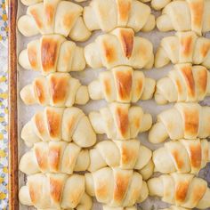 freshly baked pastries on a baking sheet ready to be cooked in the oven for consumption