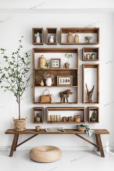 a wooden table topped with shelves filled with vases and plants