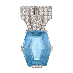 This rare Cartier Paris aquamarine brooch with its bold diamond chevron patterning dates from the 1930s, when designers created a dynamic series of jewels that featured these limpid blue gems from Brazil. Set in minimal platinum, the aquamarines’ icy blue depths were juxtaposed with the intense sparkle of brilliant- and fancy-cut diamonds, set in strong directional patterns that are perfectly Art Deco. Leave no doubt about your dedication to bejeweled modernism with this Cartier art classic, which is easily clipped to the strap of an asymmetric gown or high neck sleeveless dress. Artist: Cartier, Paris Country: France Circa: 1930s Size: 1.75” length, 0.75” width Materials: Hexagonal step-cut aquamarine (weighing approximately 35.20 carats); 80 Round-, square-, and baguette-cut diamonds (ap Cartier Aquamarine, Art Deco Jewellery, Late Art, Brooch Art, Gemstone Brooch, Art Deco Brooch, Circle Diamond, Diamond Brooch, Blue Gems