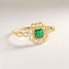 Here's Emerald Diamond Birthstone Ring Art Deco. This 14K Gold Personal Stone Engagement Ring will be perfect Personal Stone Ring for Her, Bride and wife! We can create 18K Custom Gemstone Jewelry with her wedding, engagement or anniversary night ceremony. This Luxury Ring will be best gift for your wife or mother as well! This 14K Anniversary Ring is great shower ring with Stunning and Dainty Birth Stone. This Unique Designer Ring will be will be either special night shower ring!  Emerald Diamond Ring can be switched with her birth month stone as a Birth Month Ring. This Dainty and delicate inspirational ring has symbolizing your everlasting love & serves as a perfect gift for Fiance, wife, women or gifted from mom Please check our other engagement rings: https://www.etsy.com/shop/Cristoj 14k Gold Green Diamond Princess Cut Ring, Green Princess Cut Diamond Ring In 14k Gold, Princess Cut Green Diamond Ring In 14k Gold, Gold Cubic Zirconia Birthstone Ring With Halo Setting, Gold Emerald Ring With Diamond Halo, Gold Emerald Ring With Halo Diamond Design, Gold Emerald Ring With Diamond Halo Design, Anniversary Emerald Ring With Halo Design In Cubic Zirconia, Gold Emerald Ring In Art Deco Style